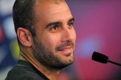 HLV Pep Guardiola, người đã giúp Messi đạt được thành công.