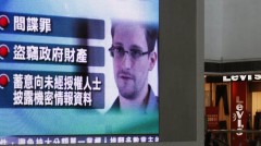Monitor broadcasts news on U.S. charges against Snowden in Hong Kong