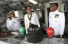 President Aquino talks to Philippine Navy officers inside the newly acquired frigate BRP Ramon Alcaraz