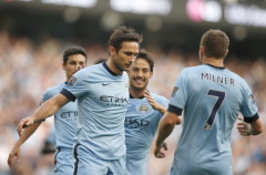 Manchester City's players run towards Frank Lampard after he scored a goal against Chelsea during their English Premier League soccer match at the Etihad stadium in Manchester