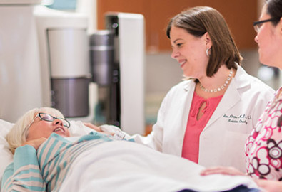 Uterine cancer physician, Dr. Ann Klopp, comforts a patient in the radiation oncology clinic
