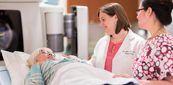 Uterine cancer physician, Dr. Ann Klopp, comforts a patient in the radiation oncology clinic