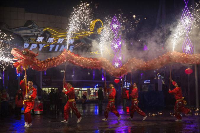Chinese artists perform a dragon dance at a local amusement park during celebrations for the Lunar New Year February 19, 2015 in Beijing. Dozens of Chinese netizens raised a petition calling for the cancellation of CCTV’s Chinese New Year Gala, condemning the performances’ discriminatory and sexist content. (Kevin Frayer/Getty Images)