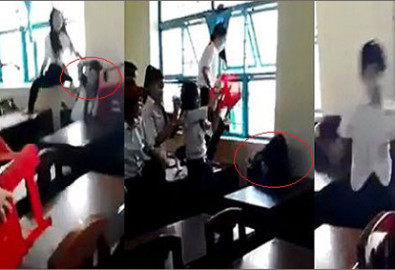 Nữ sinh  lớp 7/5, trường THCS Lý Tự Trọng (TP Trà Vinh, tỉnh Trà Vinh) bị 7 bạn đánh hội đồng - Ảnh cắt từ clip