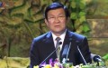 Chủ tịch nước Trương Tấn Sang bước lên bục phát biểu trong chương trình 'Khát vọng đoàn tụ' tối 27/7 tại Hà Nội.