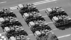 Chinese People's Liberation Army (PLA) armoured vehicles rumble past Tiananmen Square during the National Day parade in Beijing on October 1, 2009. China celebrated 60 years of communist rule with a massive military parade and elaborate pageantry on Beijing's Tiananmen Square showcasing the nation's revival as a global power.  CHINA OUT AFP PHOTO (Photo credit should read STR/AFP/Getty Images)