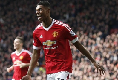 Manchester United's Marcus Rashford, runs to celebrate with teammates after scoring his sides second goal of the game during the English Premier League soccer match between Manchester United and Arsenal at Old Trafford Stadium, Manchester, England, Sunday, Feb. 28, 2016. (AP Photo/Jon Super)