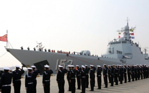 Chinese sailors salute as the destroyer Jinan returns to a military port in Zhoushan, in Zhejiang province in February. President Xi Jinping announced cuts of 300,000 military personnel by 2017. Photo: Xinhua