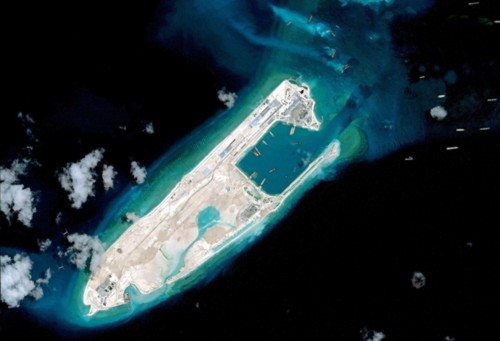China has landed a plane at an airstrip at the top end of Fiery Cross Reef in the Spratly Islands in the disputed South China Sea.