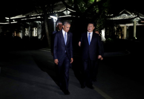 U.S. President Barack Obama and Chinese President Xi Jinping walk together at West Lake State Guest House in Hangzhou, in eastern Chinas Zhejiang province, on Saturday.