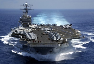 050315-N-3241H-001
The nuclear powered aircraft carrier USS Carl Vinson (CVN 70) plows through the Indian Ocean as aircraft on its flight deck are prepared for flight operations on March 15, 2005. The Carl Vinson Strike Group is en route to the Persian Gulf to support for Operation Iraqi Freedom. DoD photo by Petty Officer 3rd Class Dusty Howell, U.S. Navy. (Released)
