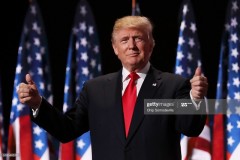CLEVELAND, OH - JULY 21: Republican presidential candidate Donald Trump gives two thumbs up to the crowd during the evening session on the fourth day of the Republican National Convention on July 21, 2016 at the Quicken Loans Arena in Cleveland, Ohio. Republican presidential candidate Donald Trump received the number of votes needed to secure the party's nomination. An estimated 50,000 people are expected in Cleveland, including hundreds of protesters and members of the media. The four-day Republican National Convention kicked off on July 18. (Photo by Chip Somodevilla/Getty Images)