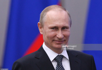 SOCHI, RUSSIA - MARCH 17: Russian President Vladimir Putin attends an awarding ceremony for Russian team members who won medals at the Winter Paraltmpic games on March 17, 2014 in Sochi, Russia. Russia topped the medal table at the 2014 Winter Paralympics with 80 medals, 30 of which were gold. (Photo by Sasha Mordovets/Getty Images)